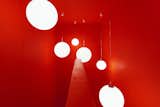 The staircase shines in bright neon red and clearly marks the entrance into the new Office of the Department of SmartDigital.   Photo 7 of 9 in SmartDigital Office Berlin by IONDESIGN Berlin