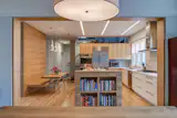 Book shelf at end of kitchen island. Built in bench seating.