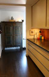 A Canadian armoire from the 19th century fits rightfully within the walls of the building built at that time.
