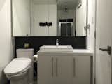 The third bathroom has a clean,modern, and masculine feel.