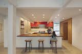 Phase One kitchen remodel with reclaimed Eucalyptus, solid walnut, and Jura limestone. Tractor counter stools from DWR.