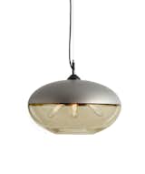 Large voluminous curves make up the Parallel Orb's stunning shape.  It is the largest pendant in the collection, making it a great centerpiece light or when used in multiples to create dramatic scale.  It features a three bulb cluster branching out from the metal top and illuminating the handblown glass below.  Each piece is made with care in our Minneapolis studio.