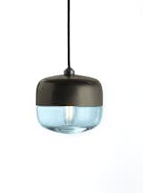 The Carina light has a wide, curved shape comprised of handblown glass and formed aluminum. Its compact design works perfectly in multiples and maintains a strength on its own.
