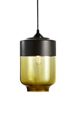 With tight curves and clean lines, this modern canister form is both classic yet contemporary. While designing this light we took inspiration from hanging oil lanterns that used to adorn homes of a prior generation. With its crisp lines and sensuous color it illuminates spaces that are traditional or contemporary, giving a feeling of both the past and present alike.