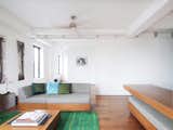 View through the depth of the apartment with sleeping area open. Custom designed furniture by Robert Garneau.