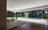 Although the existing house has large expanses of glass oriented to the backyard, much of the openness had been altered with compartmentalized spaces and low ceilings.