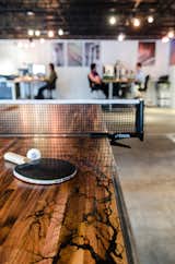 Once the electrical erosion was complete, Davis sanded down the table and added wax and epoxy to create a smooth, flush surface. When it's not being used for an afternoon ping pong match, Vertical Arts employees release the table into two halves that can be used for drawing, client engagement, or impromptu breakout sessions.&nbsp;