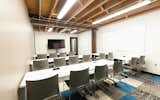 Large meeting room that is insanely reconfigurable. Board meetings, seminars, classes, off-sites, etc. The 70" screen is on a caddy and can move around as well, is equipped with an Apple TV for easy presentations.  Photo 1 of 25 in Covo by Covo Coworking