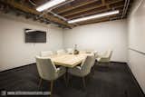 The Porter Room, one of our many meeting rooms, decked out with beautiful furniture, timber ceilings, and state-of-the-art A/V equipment.   Photo 19 of 25 in Covo by Covo Coworking