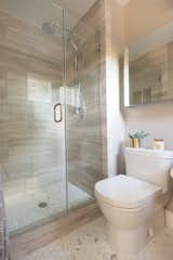 Travertine shower wall with linear pattern