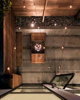 Outdoor, Concrete Patio, Porch, Deck, Walkways, Small Patio, Porch, Deck, Hardscapes, Landscape Lighting, Trees, Shrubs, Back Yard, Wood Fences, Wall, and Hanging Lighting View of patio from upper terrace  Photo 13 of 14 in SF House-Tech-Art-Play by building Lab