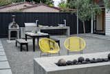 The area between the outdoor kitchen and fireplace can be rearranged to fit the moment