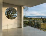 Outdoor, Trees, Hardscapes, and Concrete Patio, Porch, Deck Framed views of the surrounding landscape from main floor level  Photos from Hilltop Haven