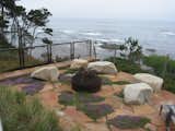 Elements in the landscape such as wall benches, stairway landings, a belvedere overlook and the seat rocks at the fire pit area shown here provide opportunities to stop and take in the view.