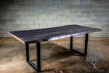 Live edge grey stained maple dining table on U shape steel legs.  