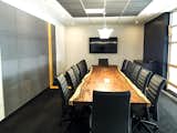parota live edge boardroom table on concrete base.