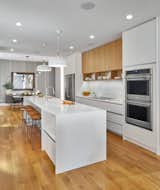 Kitchen, Refrigerator, Wall Oven, Cooktops, Stone, White, Wood, Light Hardwood, Stone Slab, Pendant, Recessed, and Undermount Kitchen  Kitchen Pendant Wall Oven Stone Light Hardwood Cooktops Undermount White Photos from Arch