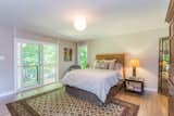 Master Bedroom - with balcony overlooking the private, shady backyard  Photo 9 of 11 in Sophisticated urban living in a pastoral setting - Available by Angela Roehl Real Estate