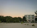 As the sun sets over the Gulf of Mexico, the moon rises above the Biosphere of Celestun
