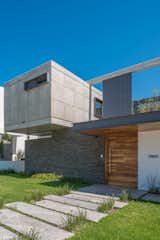 Exterior, House Building Type, Metal Roof Material, and Concrete Siding Material ENTRANCE  Photo 1 of 14 in CASA SEKIZ by Taller de Arquitectura