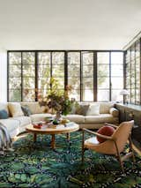 Living room.  Steel casement windows throughout home provide contrast.