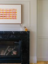 Library; fireplace surround in black marble with a modern profile.