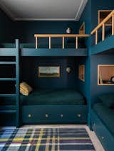 Bunk room with custom, built-in bunk beds.