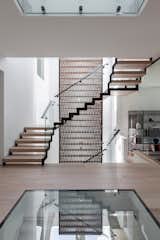 Stack House / staircase, terracotta screen, glass floor