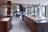 Kitchen, Accent Lighting, Marble Backsplashe, Wall Oven, Cooktops, Marble Counter, Marble Floor, Wood Cabinet, Range Hood, Range, and Pendant Lighting  Photo 5 of 7 in Ann Arbor by Weather Shield