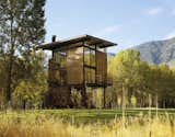 This three-story, 1,000-square-foot cabin in Washington State draws inspiration from fire towers and tree houses. Tom Kundig’s Delta Shelter is a fire-resistant fortress with an armored steel exterior and shutters that can be manually closed using a pulley-and-gear system. The eco-friendly structure was premade off-site and then assembled on the property for minimal impact on its surrounding natural habitat.