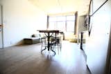 Looking out from the far end of the main living space, a bank of windows spans nearly the full width of the front facade.