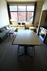 Looking out and over the kitchen island at the living room's "raw" space