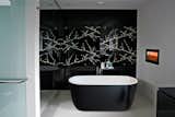 Designed for compact spaces, Lullaby Mini stands at just 55" long yet despite its small footprint, provides a luxurious full-body soak. Crafted from Aquatica's signature AquateX™ solid surface material, the matte surface is velvety soft to the touch while exceptionally durable in nature with superior heat retention. The two tone black exterior/white interior is applied with a special oven-baking technique that forms a scratch-resistant surface bonding. 