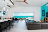 A 20-foot sliding wall of glass reveals incredible views of the turquoise waters and white sand beaches of Turks and Caicos.
