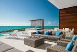 An expansive lounge area off the swimming pool is an incomparable retreat.