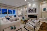 The Great Room with 12-foot ceilings, built-ins, fireplace and adjacent terrace