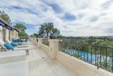 The expansive terrace off the master suite overlooks the pool and canyon views.