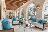 French doors off the great rooms lead to an expansive dining and lounging loggia.