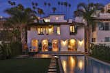 Outdoor The home's classic Spanish archways and expansive pool take on an enchanting twilight glow.  Photo 1 of 13 in A Santa Monica Beach House Built for Norma Talmadge by Luxury Homes & Lifestyle