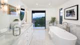 A soaking tub in the master bathroom, with doors to the observation terrace.
