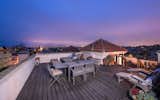 A sprawling, split-level roof deck showcases stunning, 360-degree views.