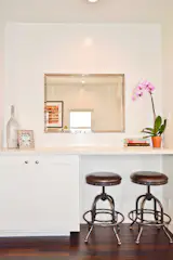 The team incorporated a built-in desk space in the living room to inspire multiple uses for the area.