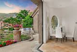Automatic walls of glass seamlessly connect indoor and outdoor living spaces.