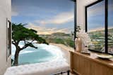 Expansive windows throughout the residence take full advantage of sweeping views.