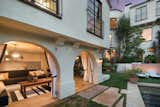 A series of archways leads to an open, poolside cabana ideal for lounging and entertaining.
