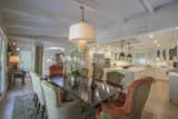  An open, entertainer’s formal dining room is lined with French doors.