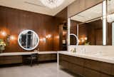 Wood-paneling elevates the master bath.