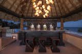 Three bars and five kitchens, including two for catering, make this the ultimate entertainer’s retreat.