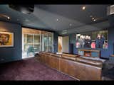 The fully-equipped media room features a 110-inch screen and 7.1 sound.