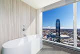 A free-standing tub with sweeping city views.